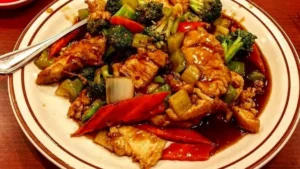 Triple Delight Chinese Food Recipe 14 Triple Delight Chinese food with chicken, beef, shrimp, and vegetables in savory brown sauce