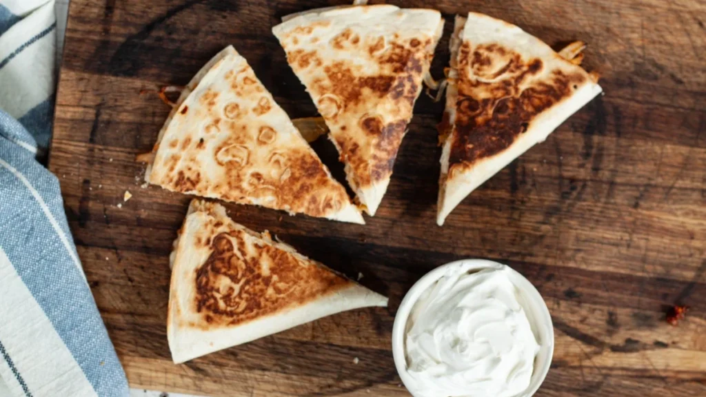 Chipotle Quesadilla Recipe 12 Chipotle chicken quesadilla served with sour cream, salsa, and Monterey Jack cheese – crispy, melty, restaurant-style quesadilla.