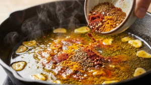 Pharaoh Sauce Recipe 17 Adding ground spices to garlic oil for Pharaoh sauce