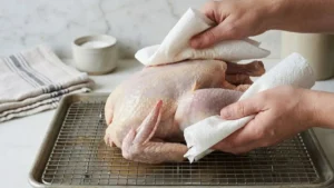 Whole Pheasant Recipes 15 Brined whole pheasant being patted dry with paper towels