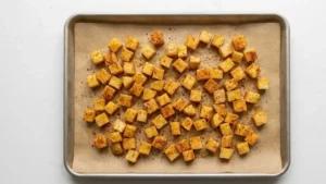 Papá Asado Recipe 17 Seasoned potatoes arranged on baking tray