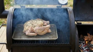 Whole Pheasant Recipes 18 Smoker preheating with light smoke and wood chips ready for cooking