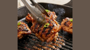 Molokai Chicken Recipe 19 Flipping Molokai chicken while grilling.