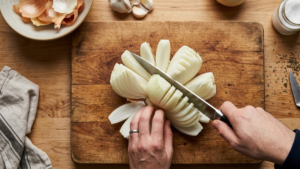 Texas Roadhouse blooming onion cutting process with large sweet onion petals